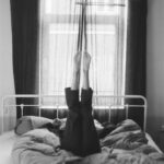 ‘아침 스트레칭’, 몸과 마음을 깨우는 일상작은 습관 person laying on a bed