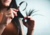 변화하는 헤어 건강 관리 트렌드, 일상 속에서 실천하는 방법 Woman examining split ends of hair with magnifying glass