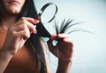 변화하는 헤어 건강 관리 트렌드, 일상 속에서 실천하는 방법 Woman examining split ends of hair with magnifying glass