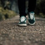 “워킹이 몸과 마음을 살린다”…걷기의 힘, 다시 주목받는 이유 a person standing on a gravel road with their shoes on