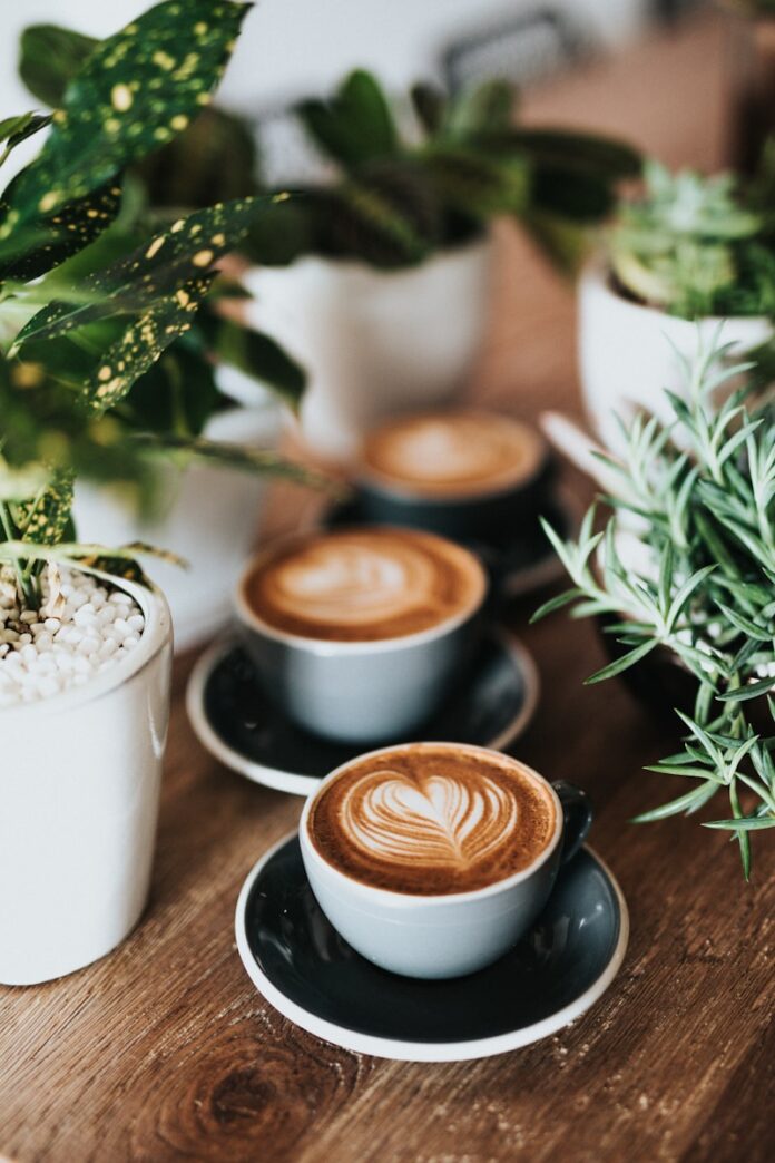Photo by Nathan Dumlao shallow focus photography of coffee late in mug on table